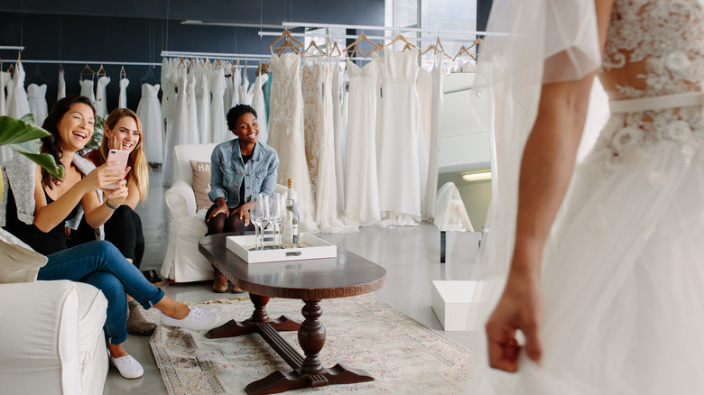 Bride trying on wedding dress