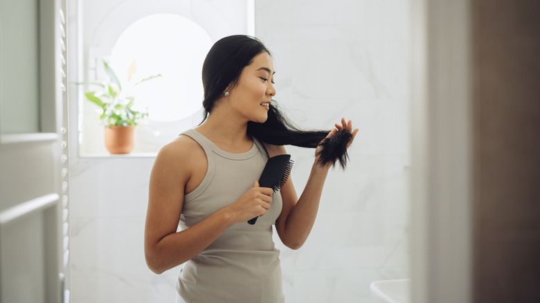 lady brushing long hair
