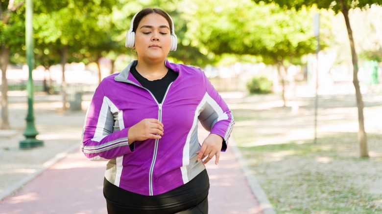 Woman running with headphones on