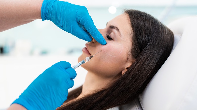 Woman getting cheek filler