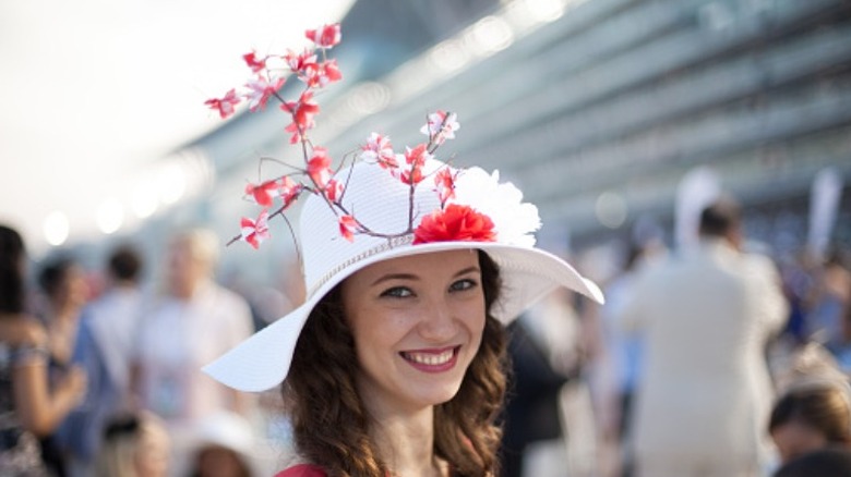 woman wearing tall hat
