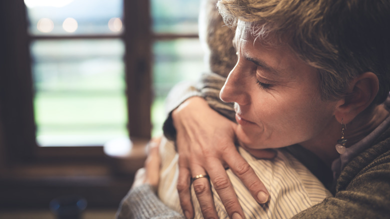 woman hugging friend