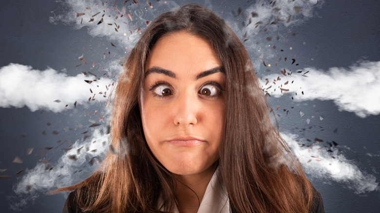 stressed woman crossing her eyes