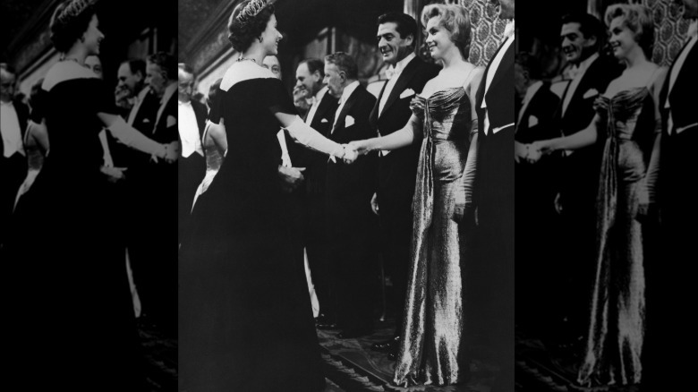 Marilyn Monroe meets Queen Elizabeth II.