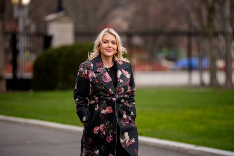 Karoline Leavitt wearing an ill-fitting coat with a busy floral outdated pattern