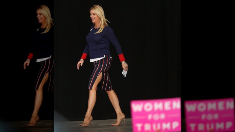 Pam Bondi wearing a skirt with a high slit at a 2016 event for Donald Trump